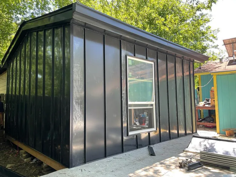 Black standing seam metal wall panels for Roof Inspection in Lynden